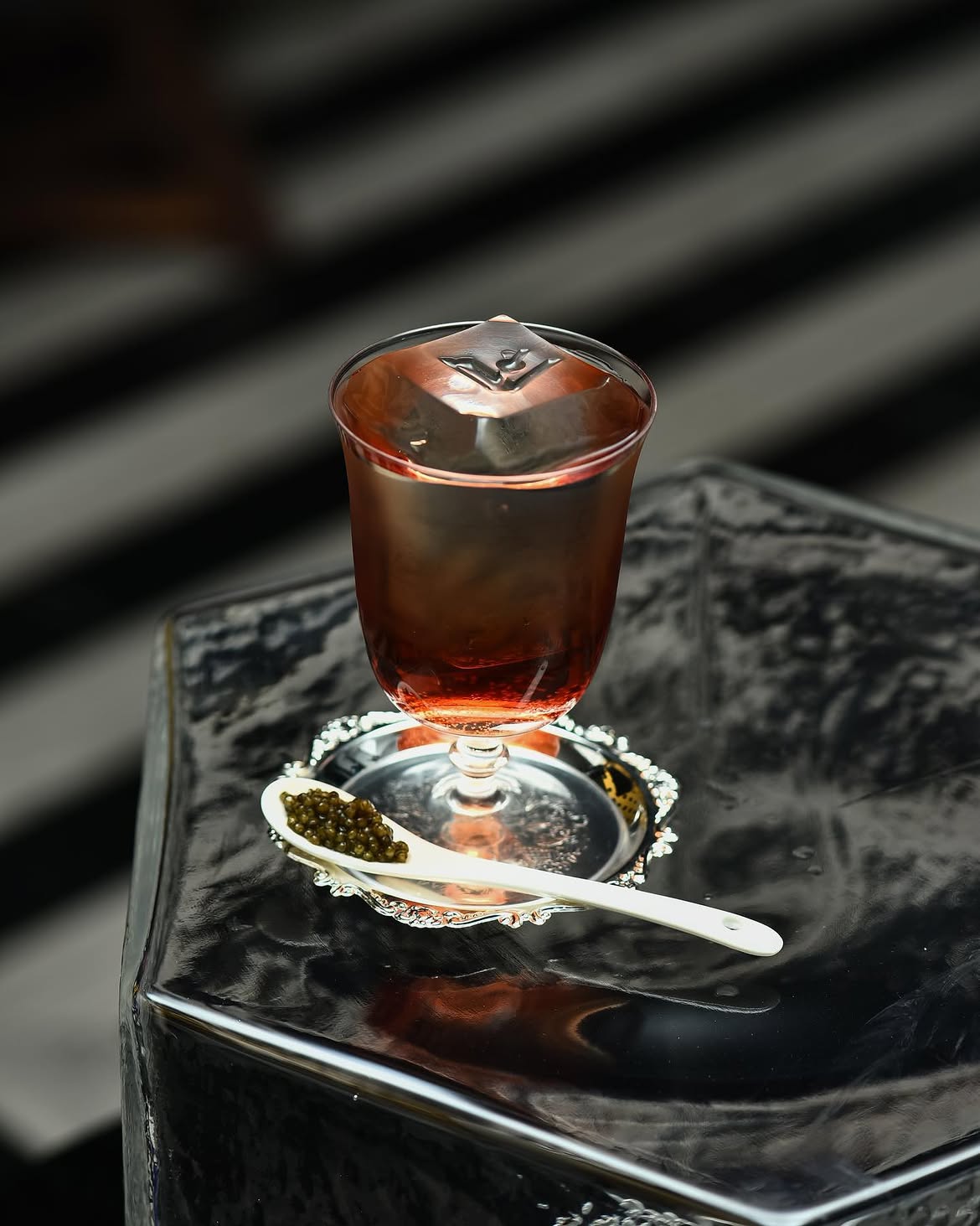 A signature cocktail finished with caviar